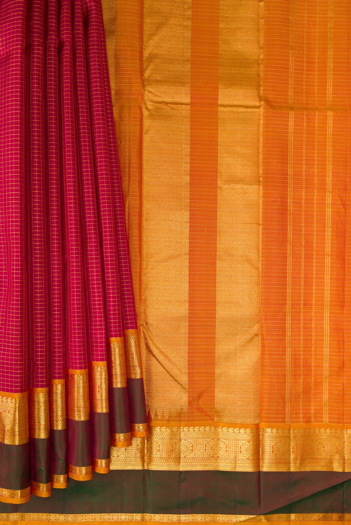 Pleats and pallu of Pure Silk Maroon Kanchipuram Saree with Checked design on the body and Zari Border. 