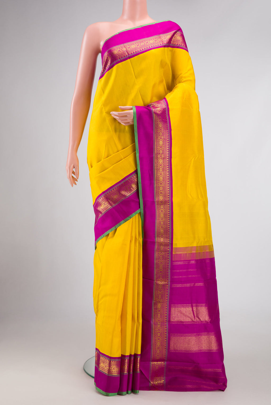 Yellow Dual Tone Kanjivaram Silk Saree with Plain Body and Zari Border.  displayed on a mannequin