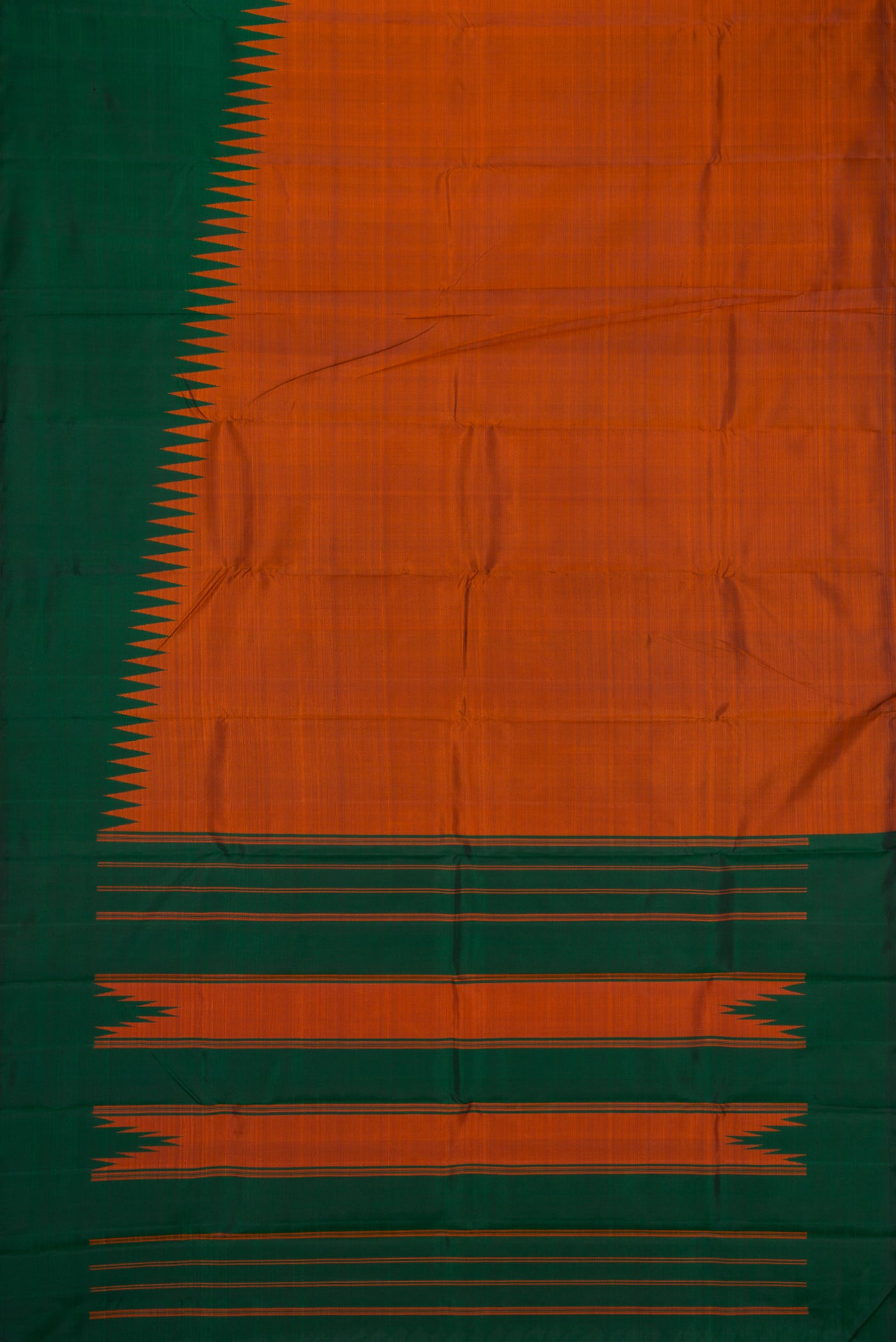 Flat view of Brick Orange Dual Tone Kanchipuram Silk Saree with Plain Body and Rising Temple Border. 