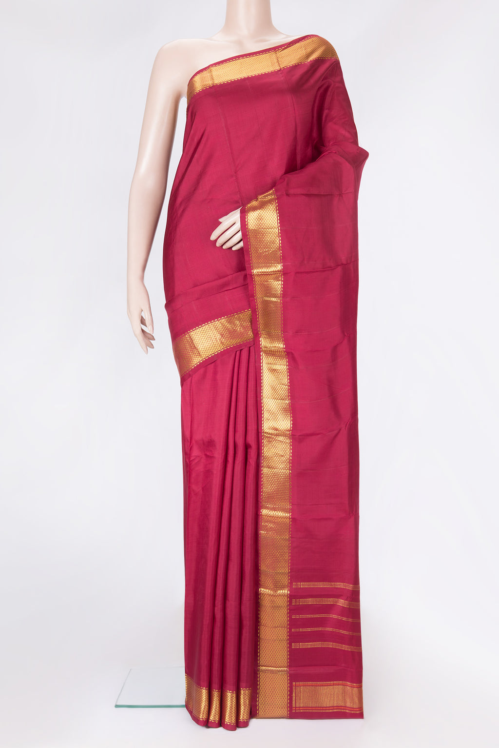 Maroon Dual Tone Kanchipuram Silk Saree with Plain Body and Zari Border.  displayed on a mannequin
