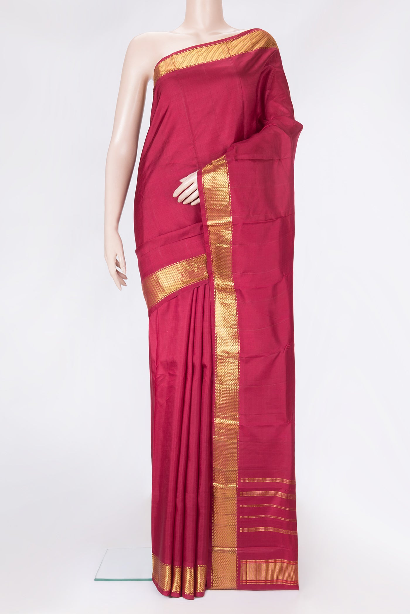 Maroon Dual Tone Kanchipuram Silk Saree with Plain Body and Zari Border.  displayed on a mannequin