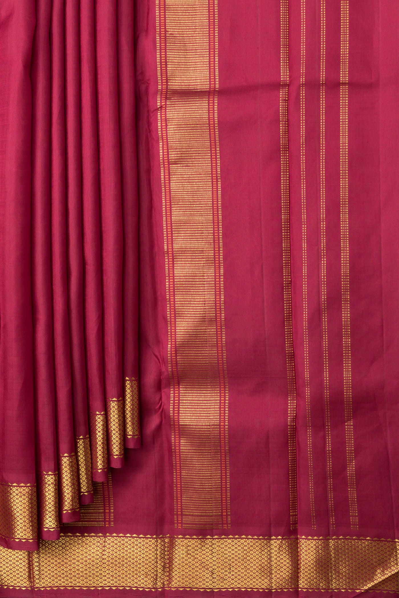 Pleats and pallu of Maroon Dual Tone Kanchipuram Silk Saree with Plain Body and Zari Border. 