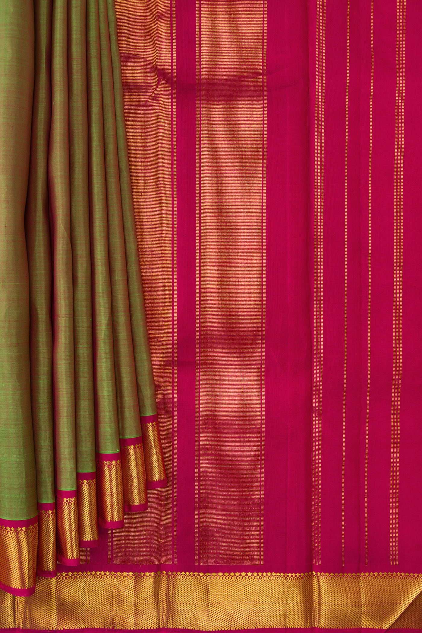 Pleats and pallu of Green Dual Tone Kanchipuram Silk Saree with Plain Body and Zari Border. 