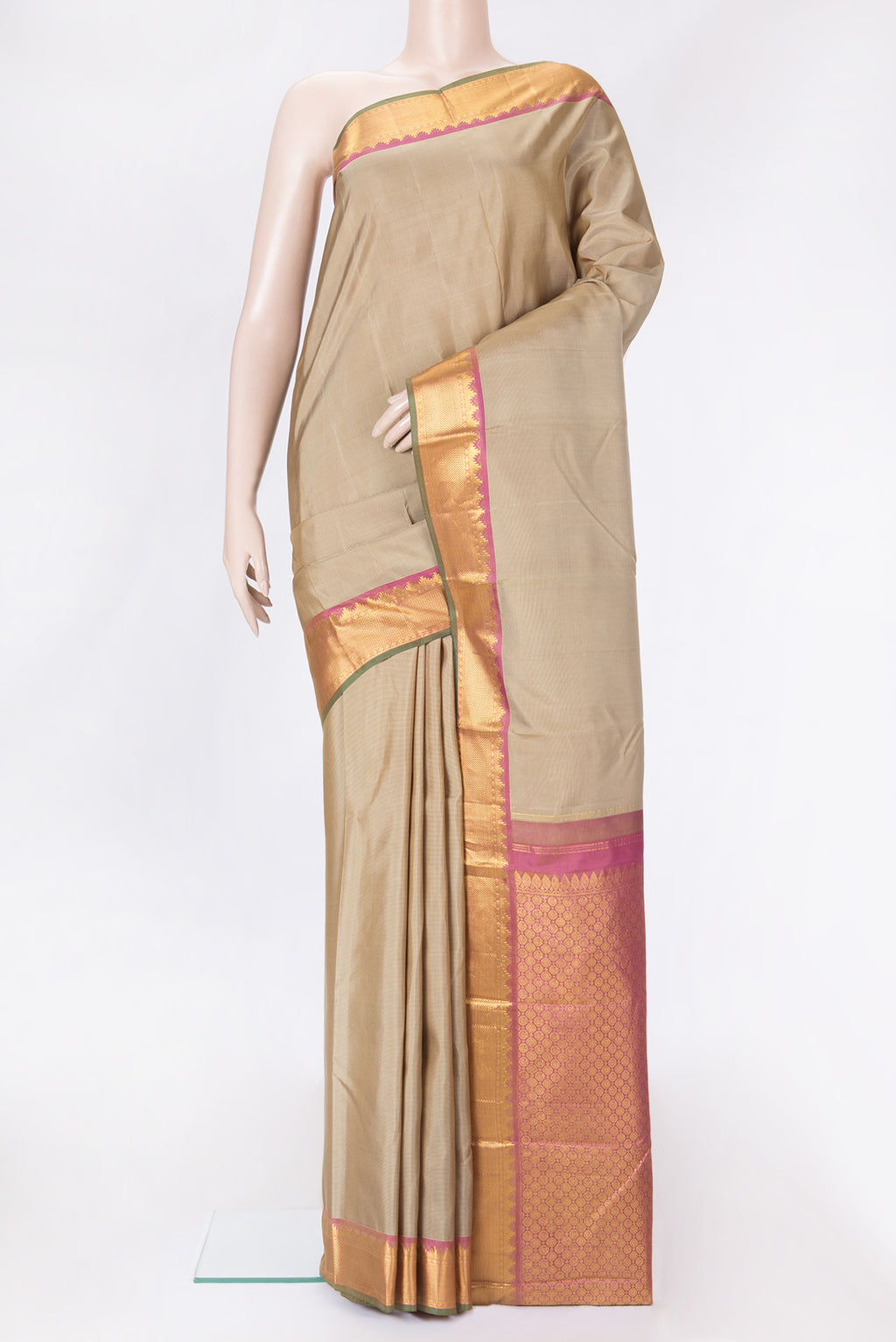Pista Green Dual Tone Kanchipuram Silk Saree with Stripes on the body and Zari Border.  displayed on a mannequin