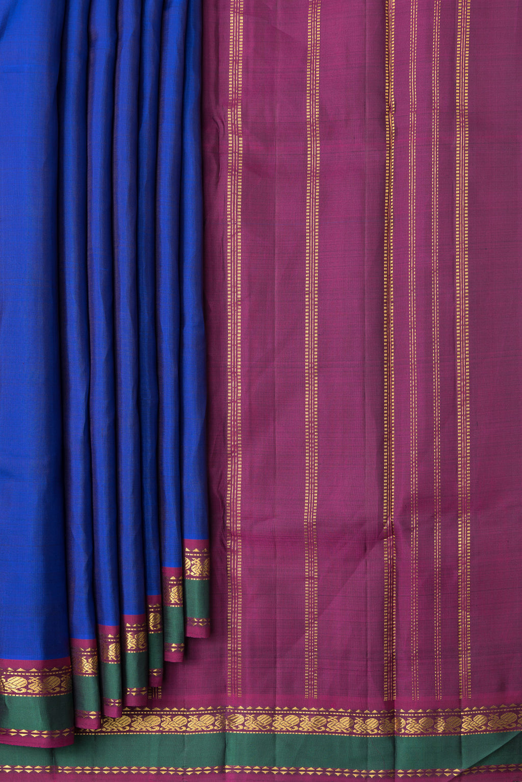 Pleats and pallu of Royal Blue Dual Tone Kanchipuram Silk Saree with Plain Body and Zari Border. 