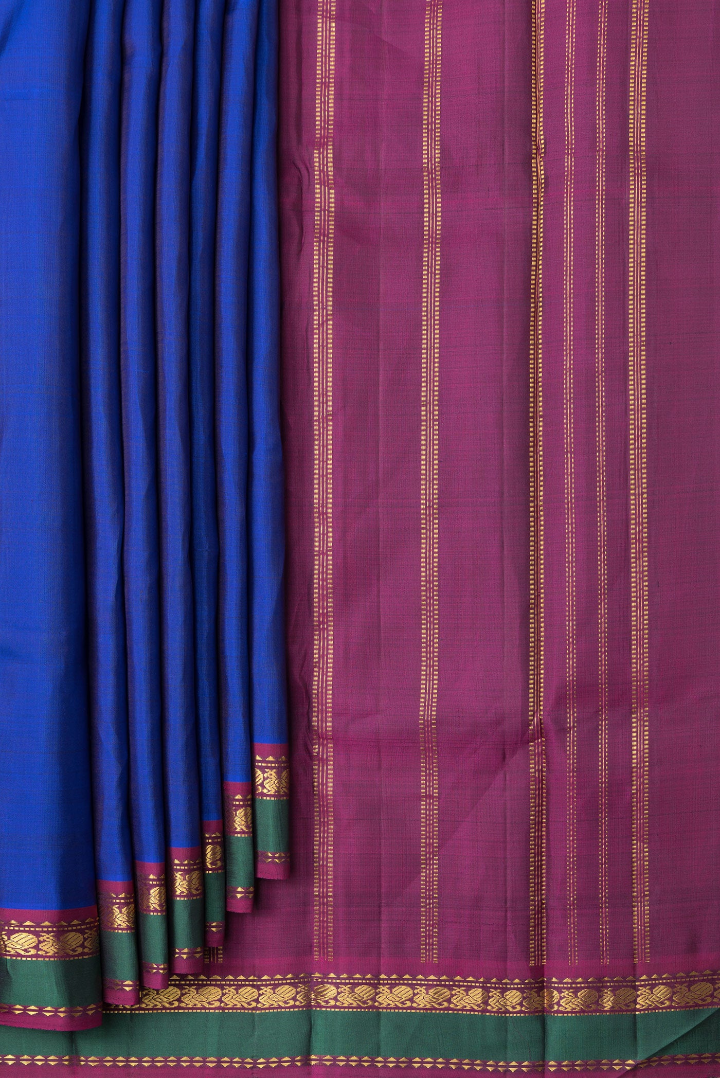 Pleats and pallu of Royal Blue Dual Tone Kanchipuram Silk Saree with Plain Body and Zari Border. 
