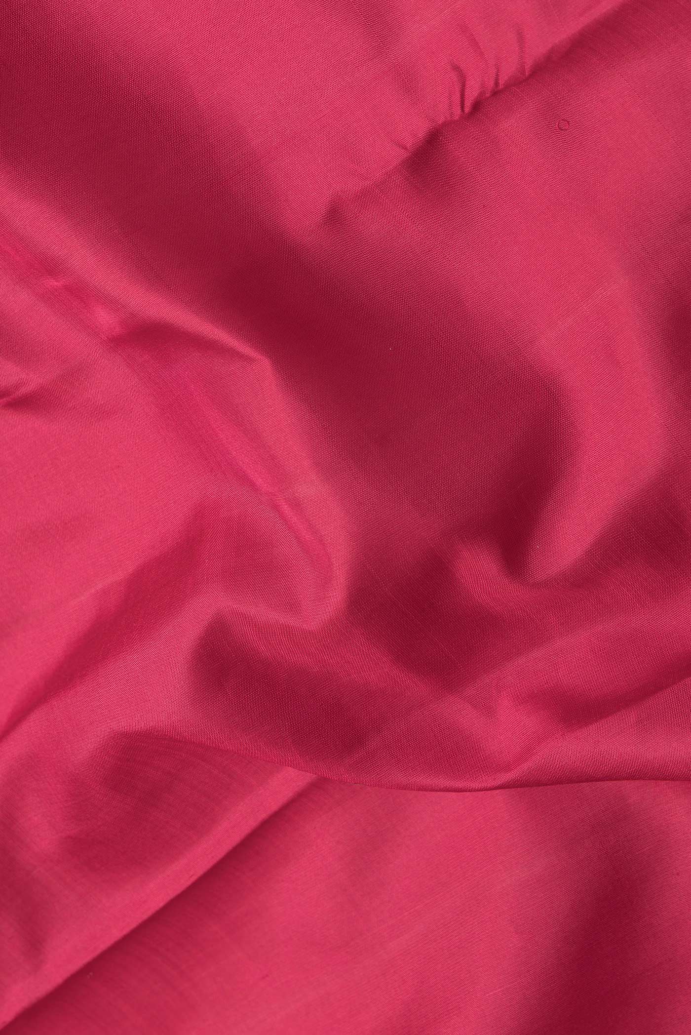 Close up of Pink Dual Tone Kanjivaram Silk Saree with Plain Body and Zari Border.  displaying folds