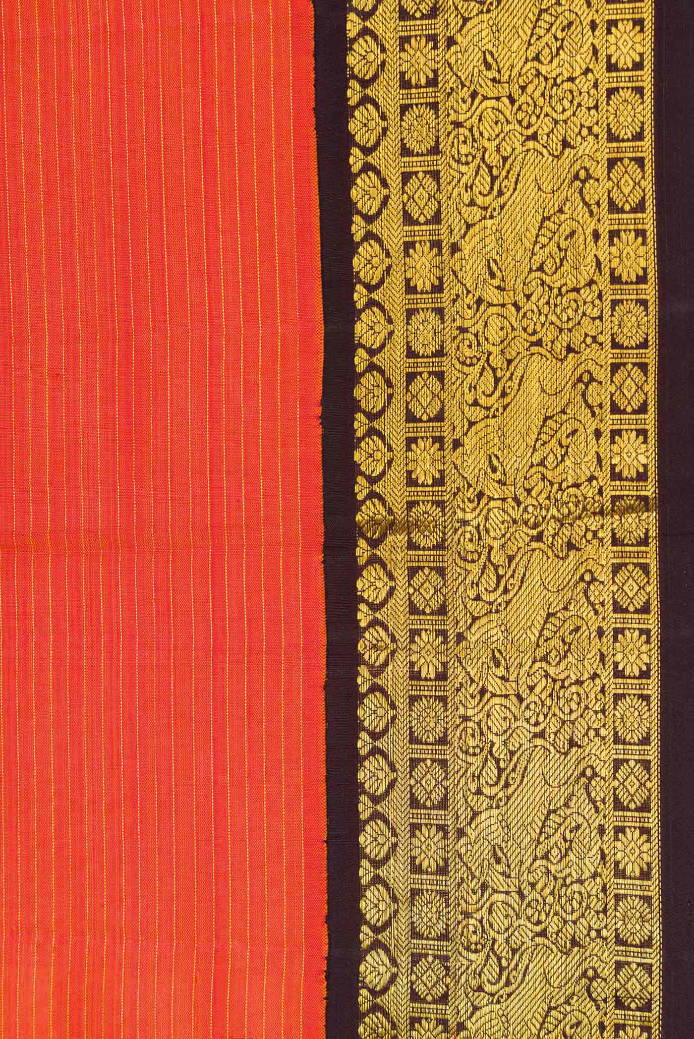 Border image of Orange Dual Tone Kanjivaram Silk Saree with Zari And Thread Butta on the body and Zari Border. 