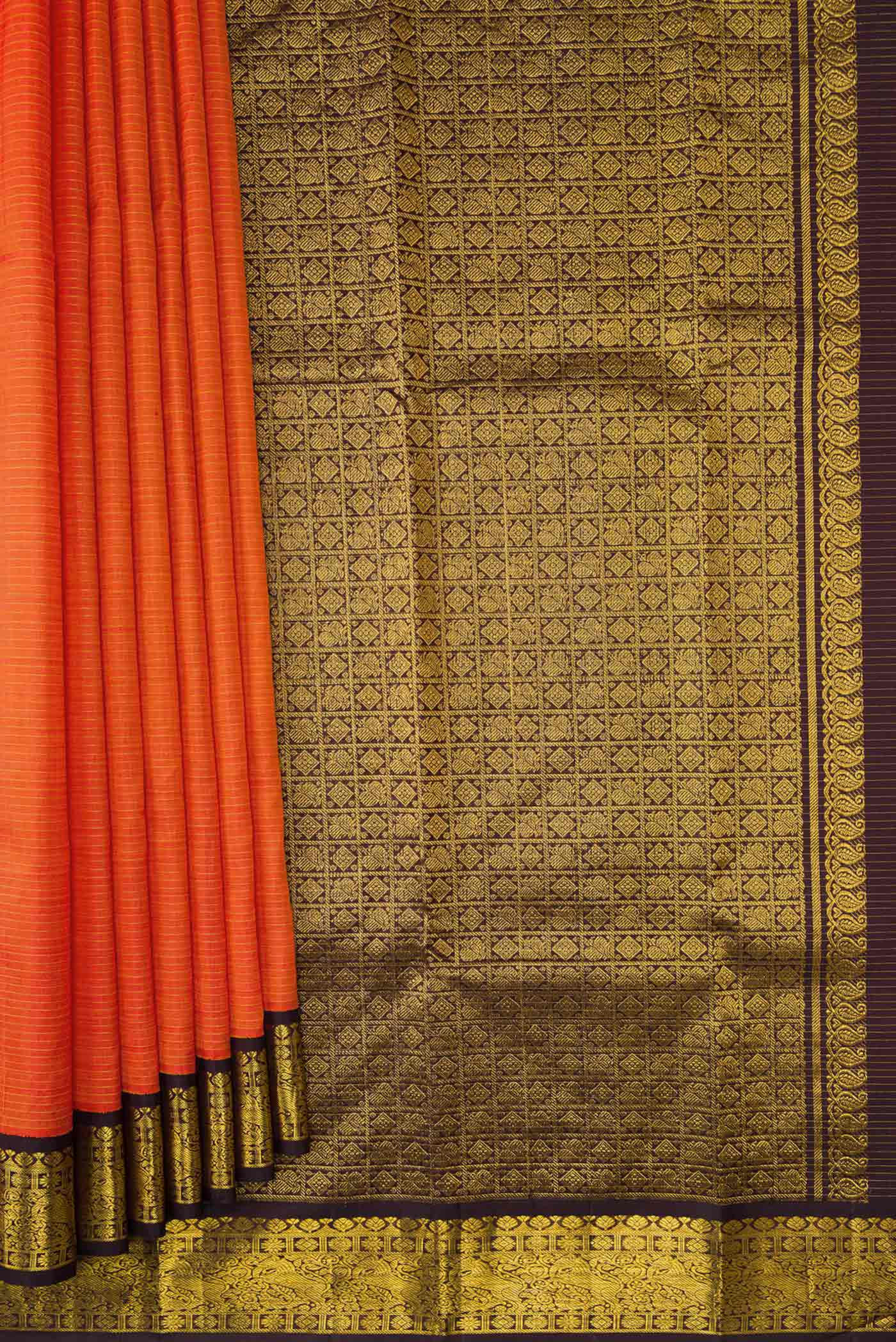 Pleats and pallu of Orange Dual Tone Kanjivaram Silk Saree with Zari And Thread Butta on the body and Zari Border. 