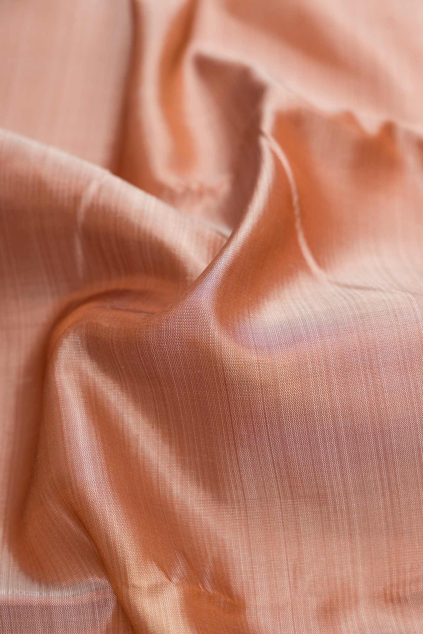 Close up of Dark Beige Dual Tone Kanjivaram Silk Saree with Plain Body and Zari Border.  displaying folds