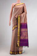 Dark Beige Dual Tone Kanjivaram Silk Saree with Plain Body and Zari Border.  displayed on a mannequin