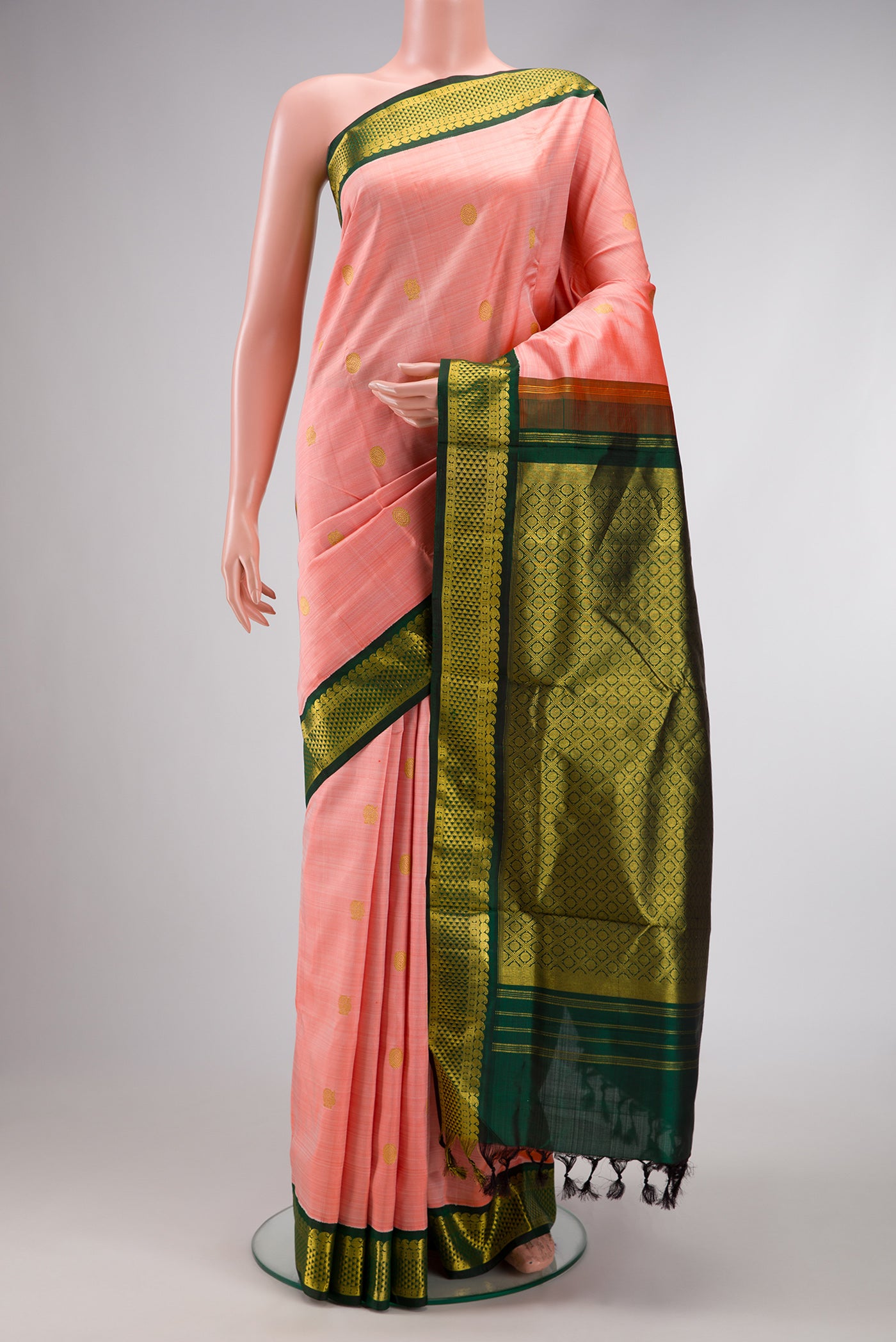 Pure Silk Pure Zari Peach Dual Tone Kanchipuram Nine Yards Saree with Zari Butta on the body and Zari Border.  displayed on a mannequin