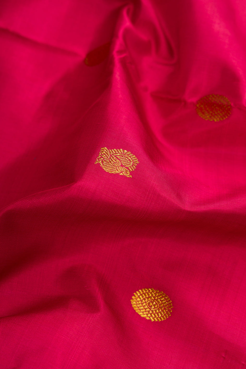 Close up of Maroon Dual Tone Kanchipuram Silk Nine Yards Saree with Zari Butta on the body and Zari Border.  displaying folds