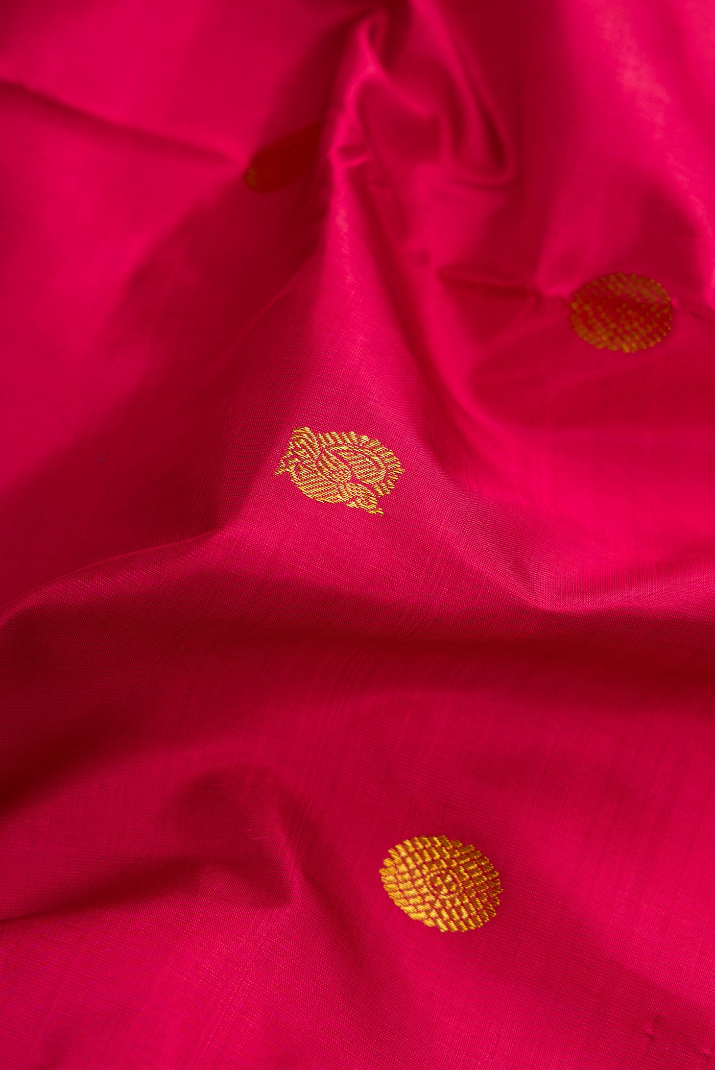 Close up of Maroon Dual Tone Kanchipuram Silk Nine Yards Saree with Zari Butta on the body and Zari Border.  displaying folds