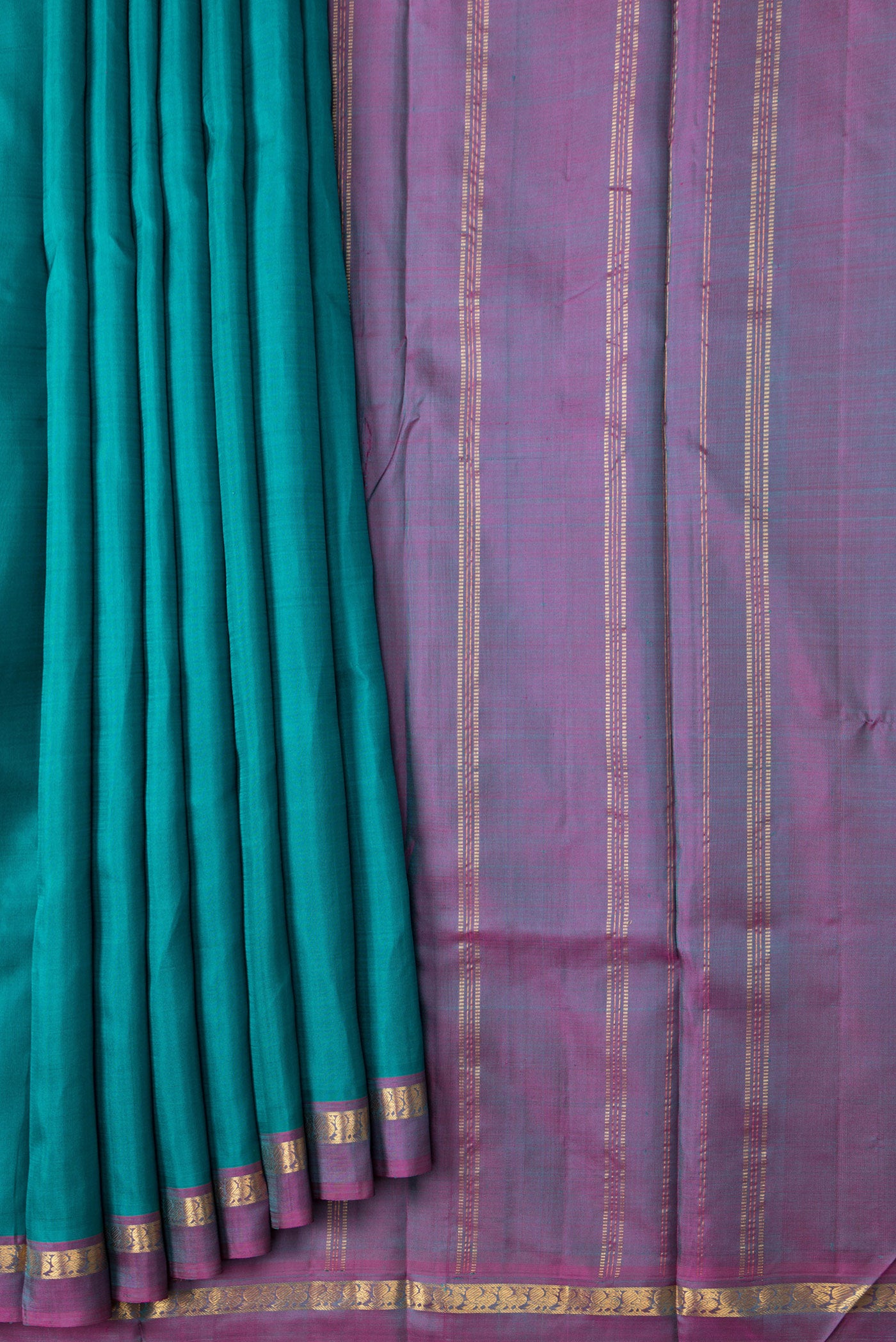 Pleats and pallu of Green Dual Tone Kanjivaram Silk Saree with Plain Body and Zari Border. 