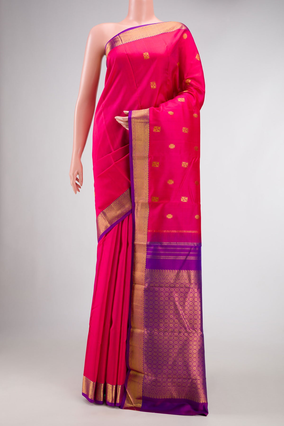 Pink Dual Tone Kanchipuram Silk Saree with Zari Butta on the body and Zari Border.  displayed on a mannequin