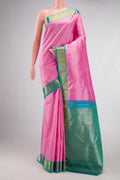 Pink Dual Tone Kanjivaram Silk Saree with Stripes on the body and Zari Border.  displayed on a mannequin