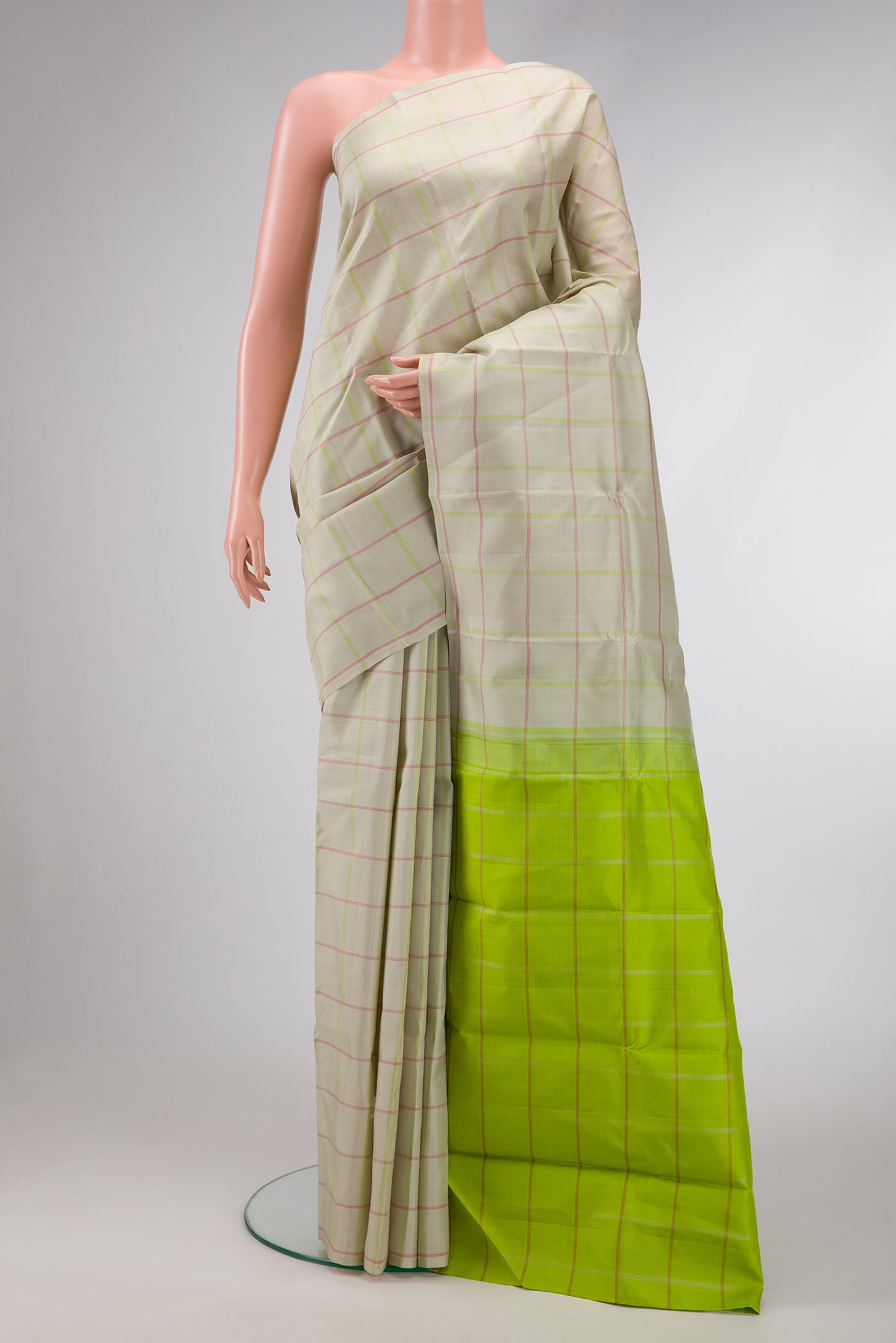 Beige Dual Tone Kanjivaram Silk Saree with Checked design on the body and Without Border.  displayed on a mannequin