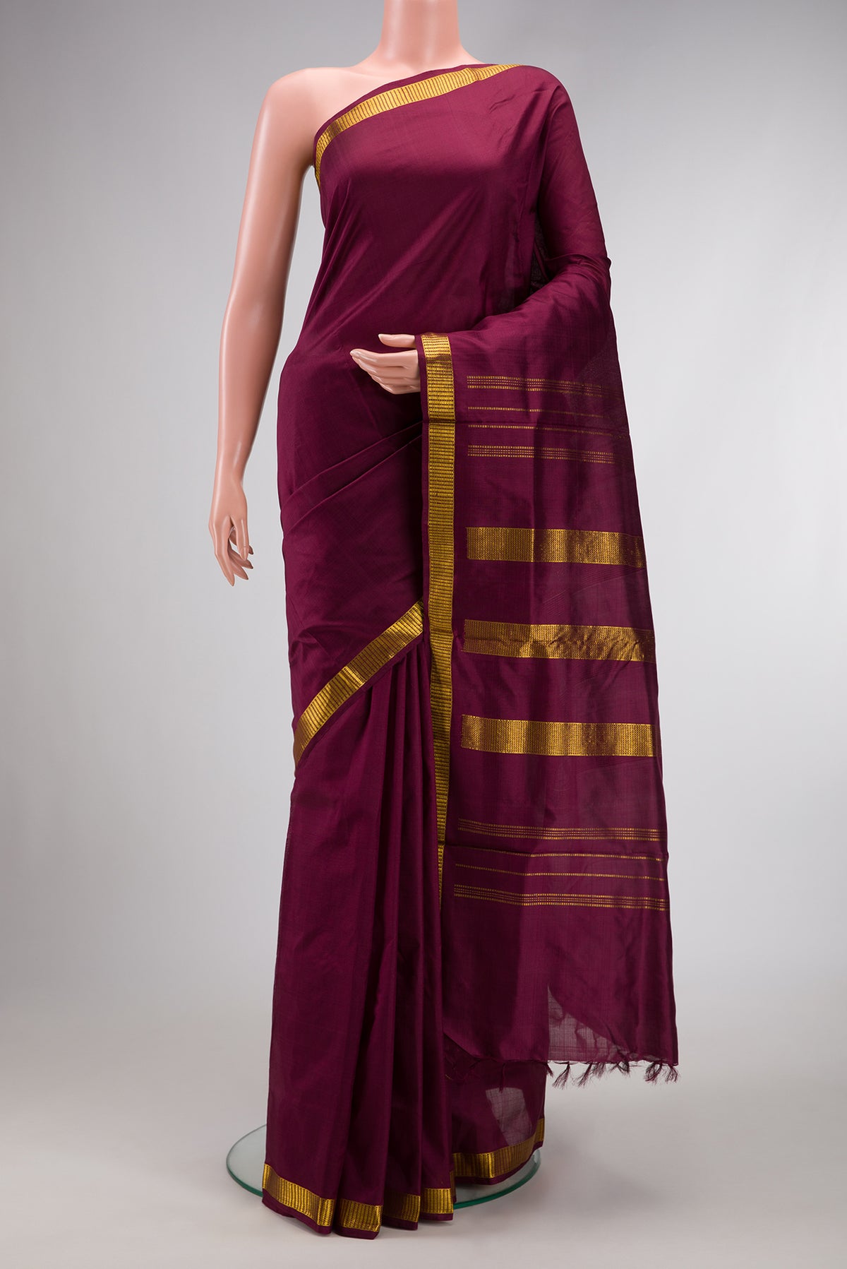 Burgundy Dual Tone Kanjivaram Silk Nine Yards Saree with Plain Body and Zari Border.  displayed on a mannequin