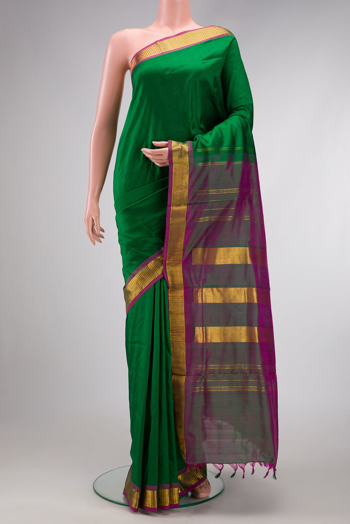 Bottle Green Dual Tone Kanchipuram Silk Nine Yards Saree with Plain Body and Zari Border.  displayed on a mannequin