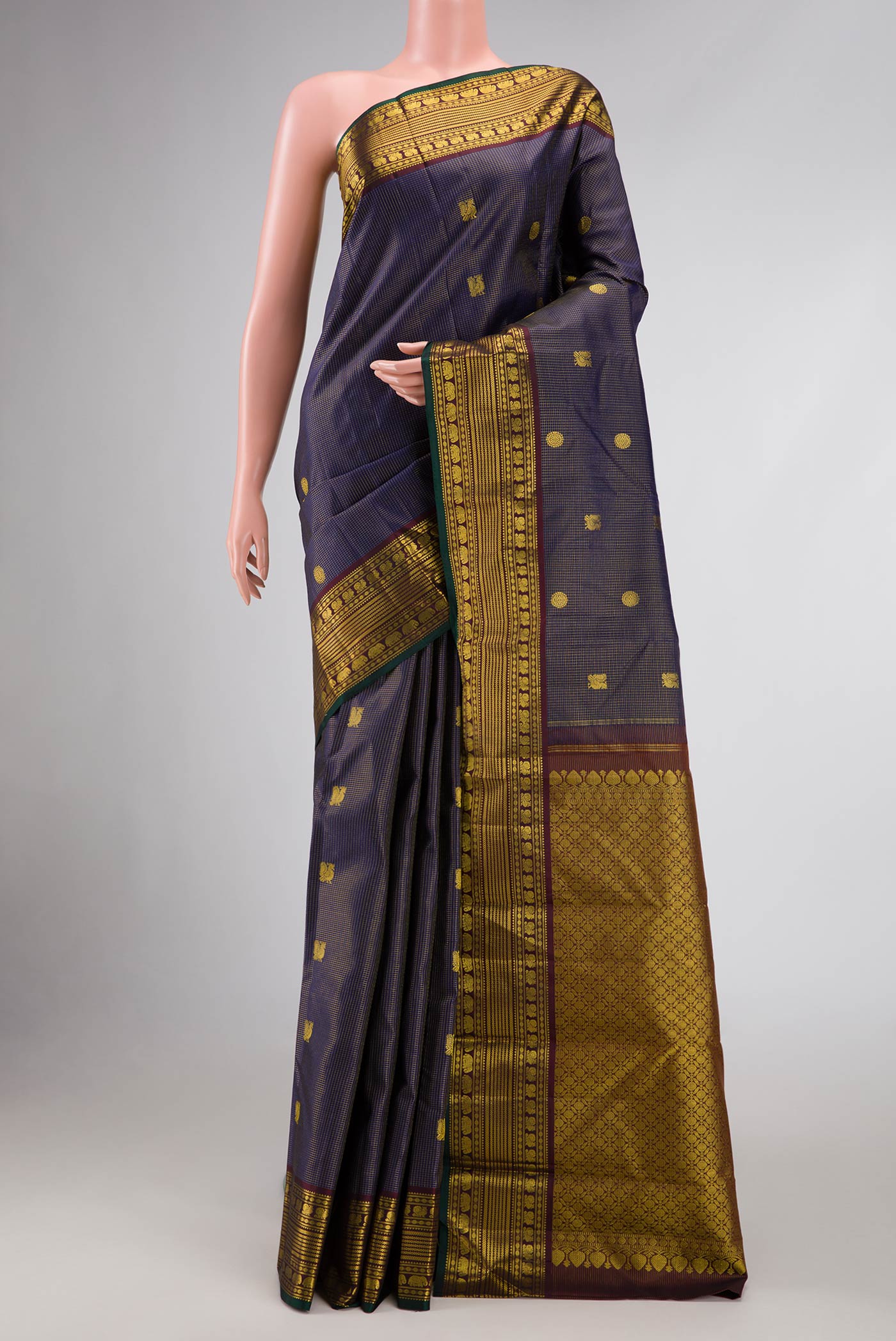 Violet Dual Tone Kanjivaram Silk Saree with Zari Butta on the body and Zari Border.  displayed on a mannequin