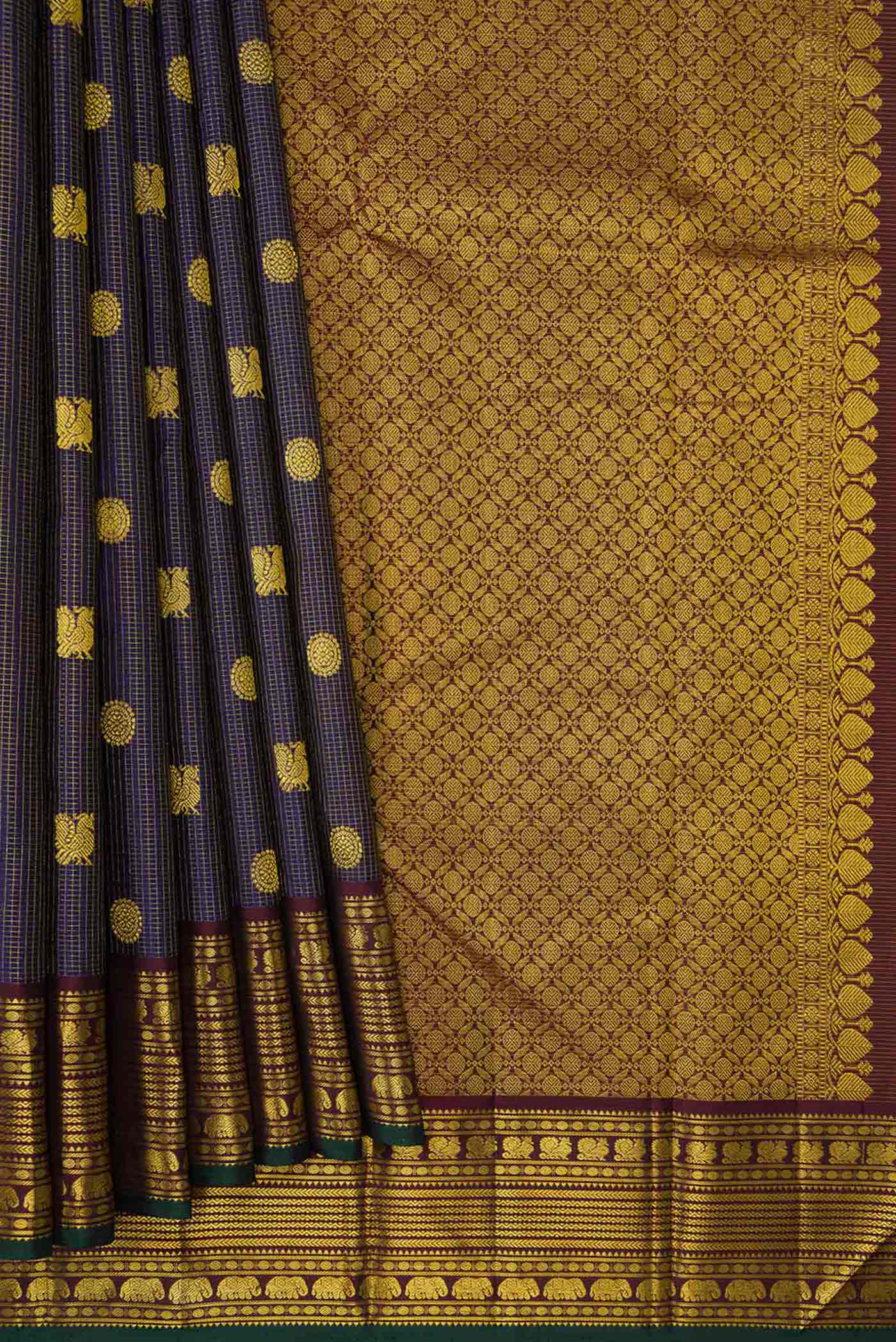 Pleats and pallu of Violet Dual Tone Kanjivaram Silk Saree with Zari Butta on the body and Zari Border. 