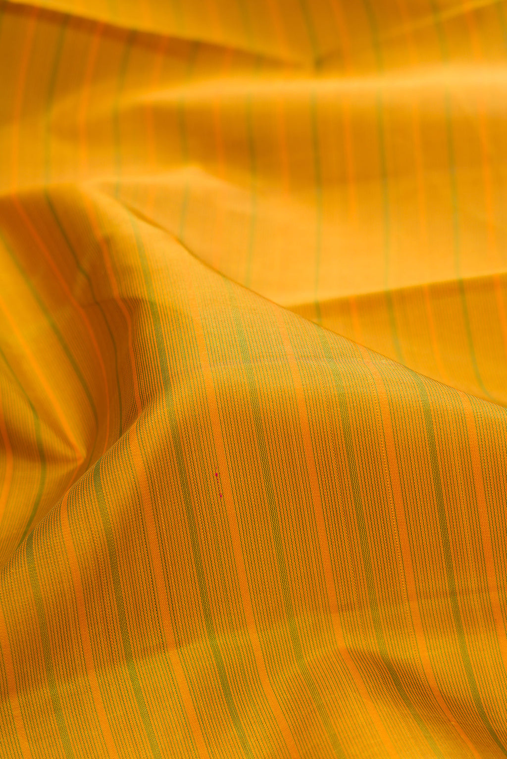 Close up of Pure Silk Mehandi Green Kanchipuram Saree with Stripes on the body and Zari Border.  displaying folds