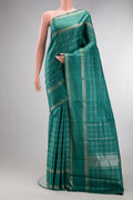 Pure Silk Teal Kanchipuram Saree with Checked design on the body and Zari Border.  displayed on a mannequin