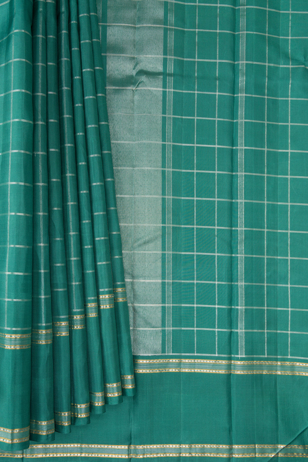 Pleats and pallu of Pure Silk Teal Kanchipuram Saree with Checked design on the body and Zari Border. 
