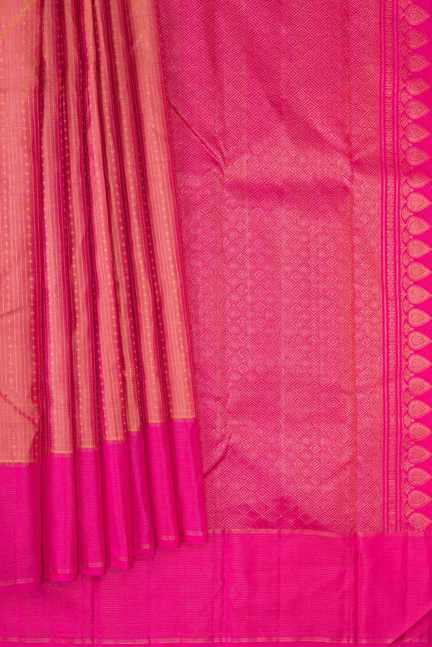 Pleats and pallu of Golden Peach Dual Tone Kanchipuram Silk Saree with Stripes on the body and Zari Border. 