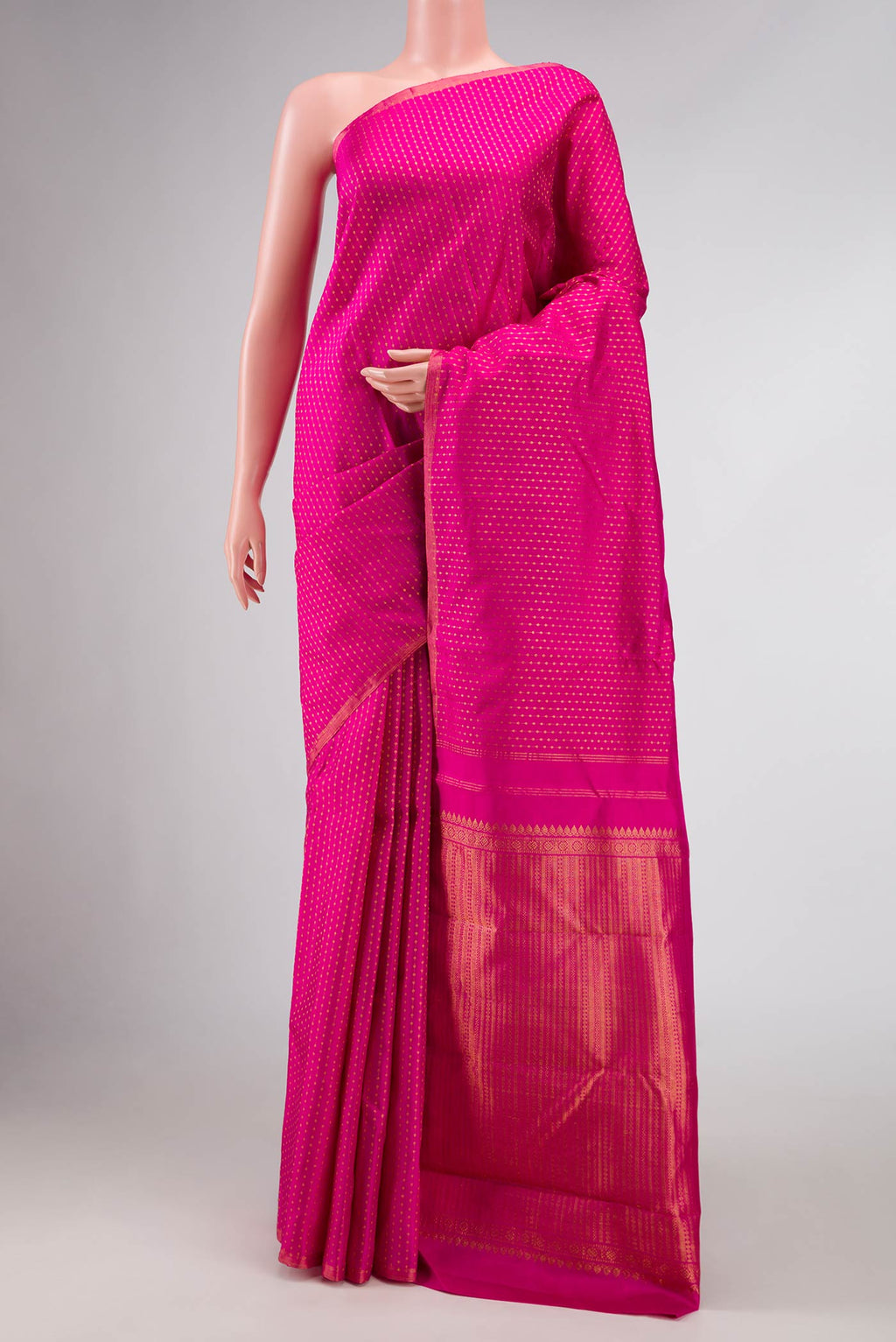 Pink Dual Tone Kanchipuram Silk Saree with Stripes on the body and Zari Border.  displayed on a mannequin