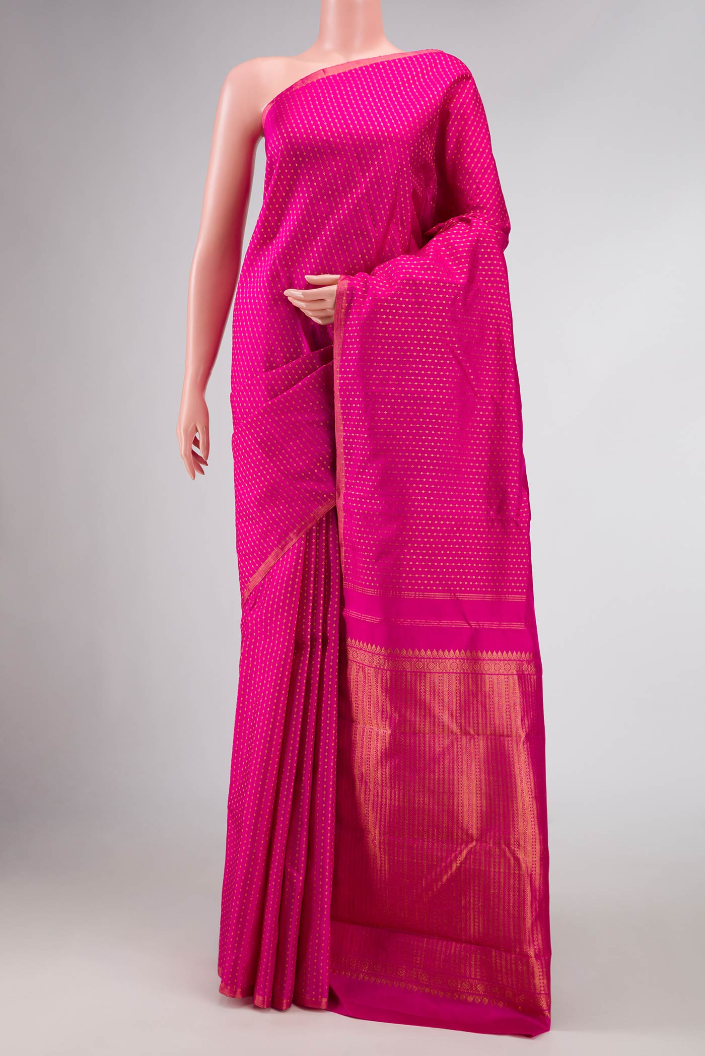 Pink Dual Tone Kanchipuram Silk Saree with Stripes on the body and Zari Border.  displayed on a mannequin