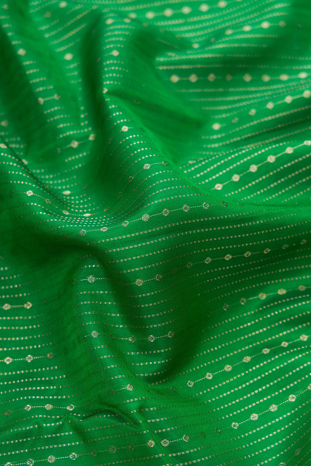 Close up of Bottle Green Dual Tone Kanchipuram Silk Saree with Stripes on the body and Zari Border.  displaying folds