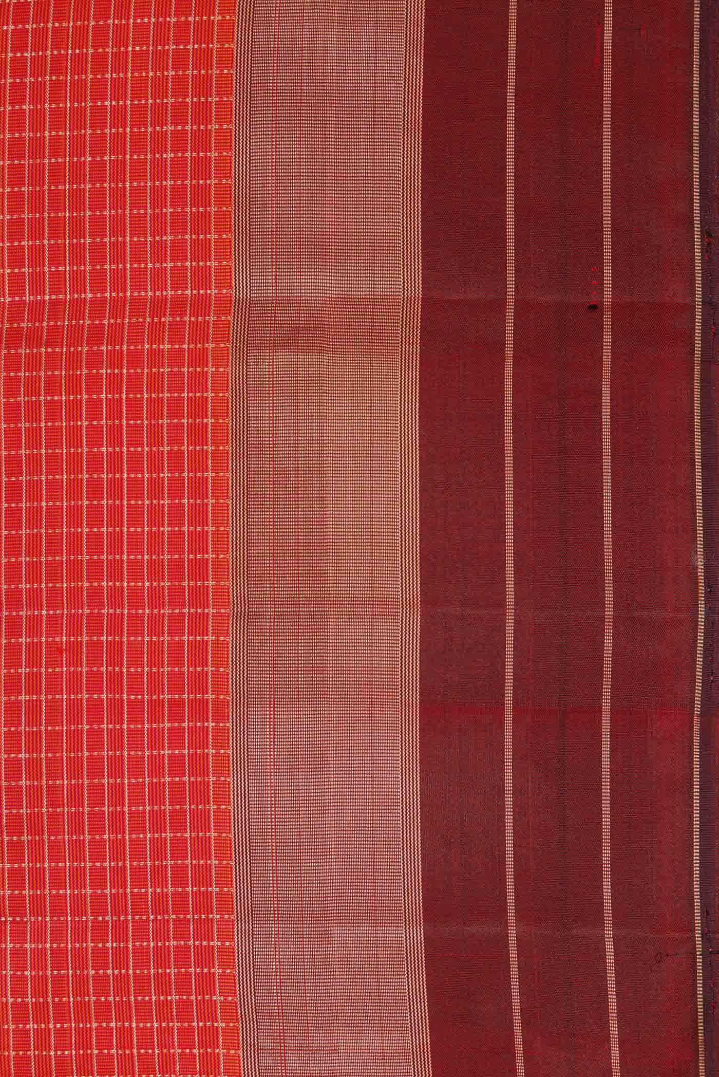 Border image of Orange Dual Tone Kanchipuram Silk Saree with Checked design on the body and Zari Border. 