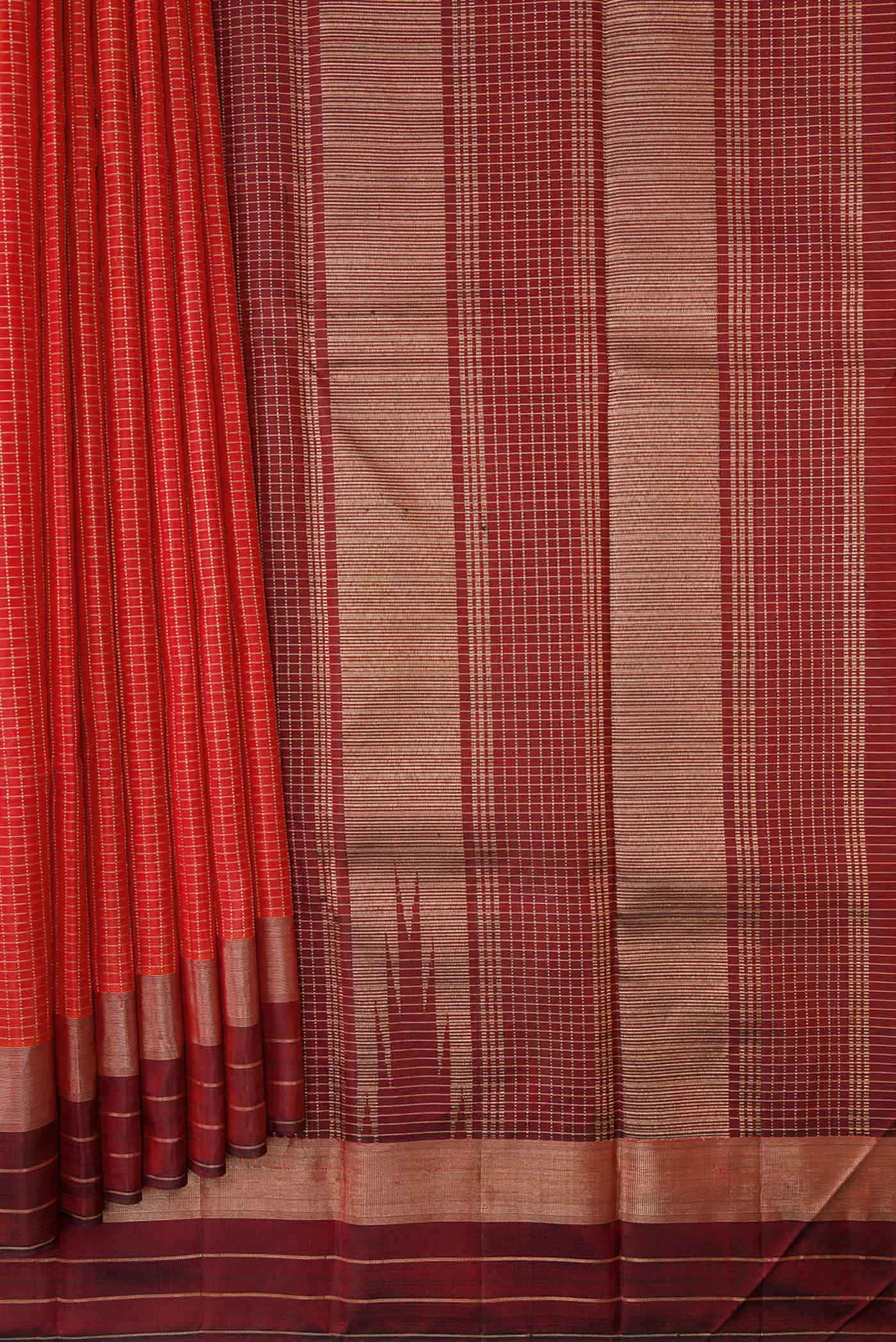 Pleats and pallu of Orange Dual Tone Kanchipuram Silk Saree with Checked design on the body and Zari Border. 
