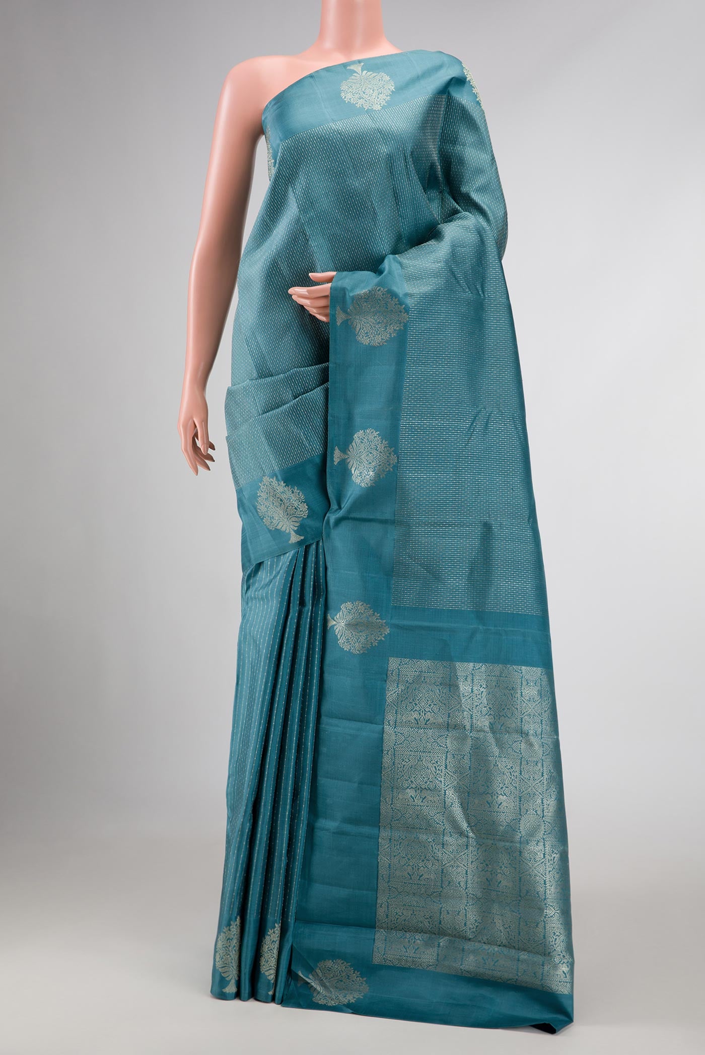 Blue Dual Tone Soft Silk Saree with Stripes on the body and Fancy Border displayed on a mannequin
