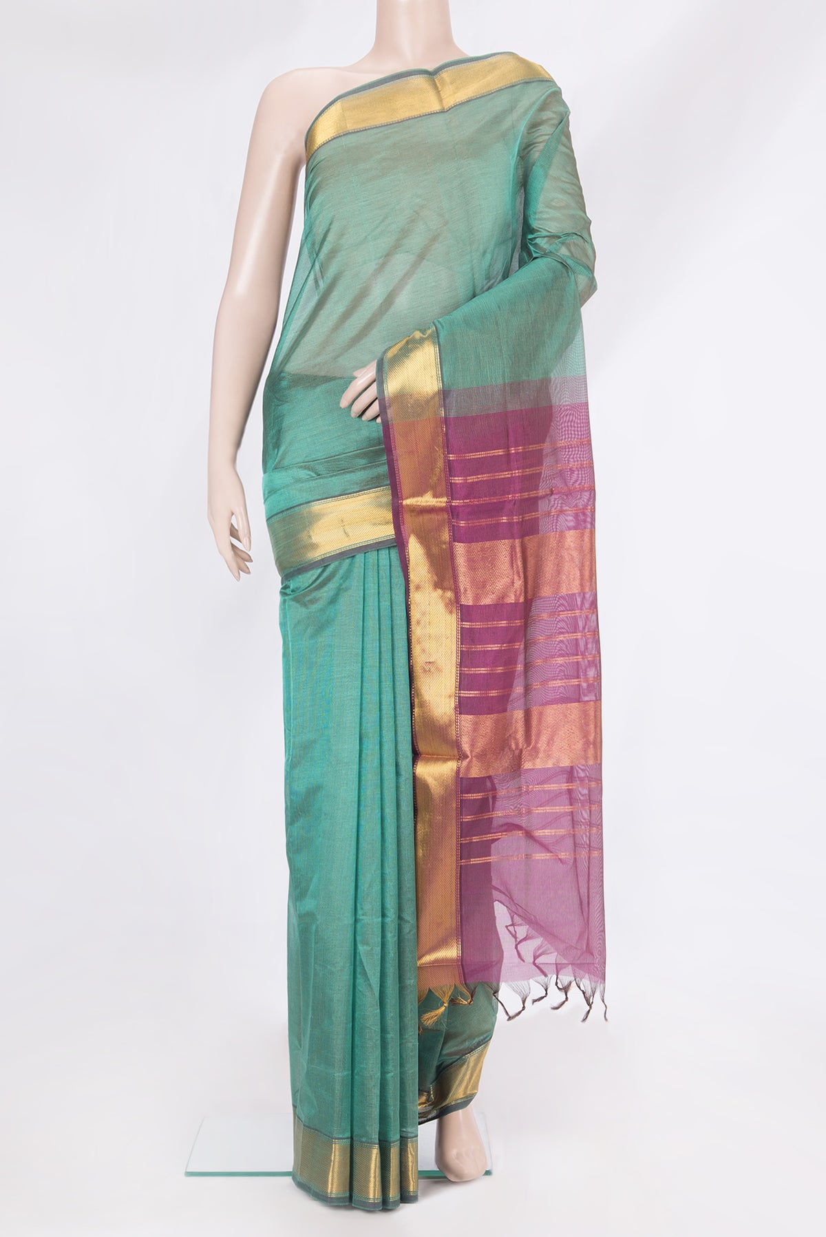 Green Silk Cotton Saree with Stripes on the body and Zari Border.  displayed on a mannequin
