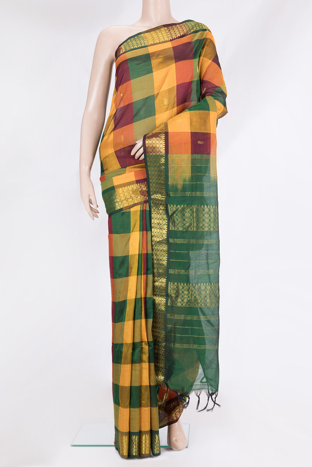 Multi Color Silk Cotton Saree with Zari Butta on the body and Zari Border.  displayed on a mannequin