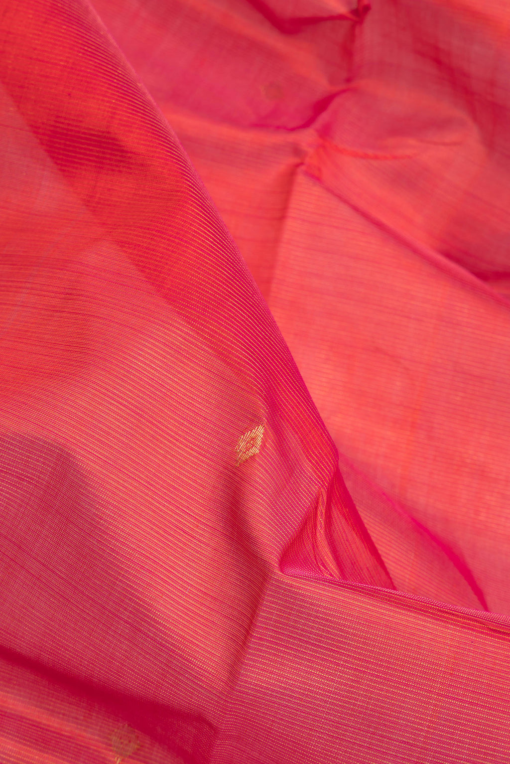 Close up of Red Silk Cotton Saree with Stripes on the body and Zari Border.  displaying folds