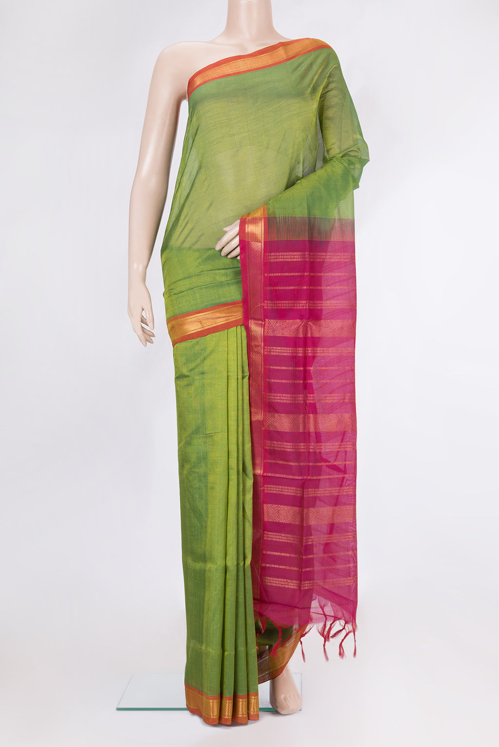 Green Silk Cotton Saree with Plain Body and Zari Border.  displayed on a mannequin