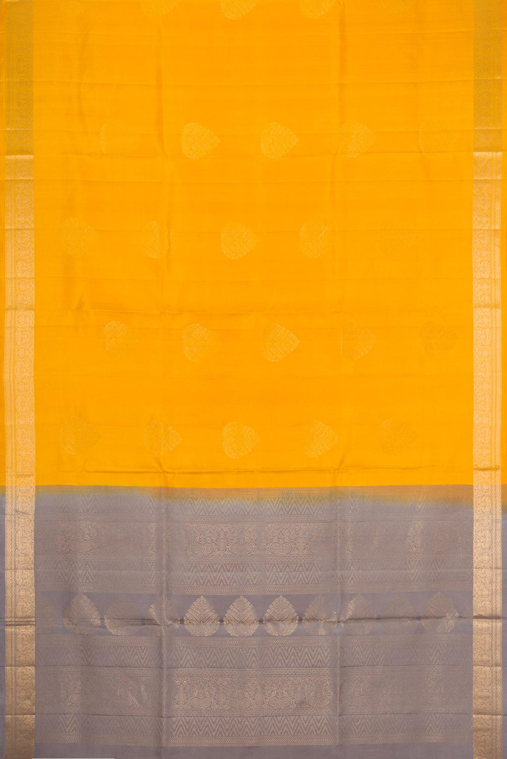 Flat view of Mustard Dual Tone Soft Silk Saree with Zari Butta on the body and Zari Border. 