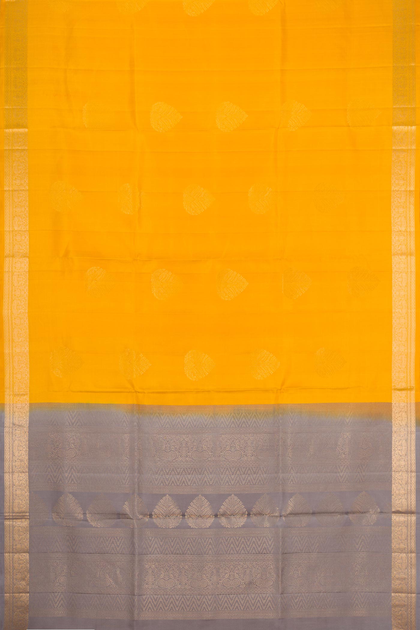 Flat view of Mustard Dual Tone Soft Silk Saree with Zari Butta on the body and Zari Border. 