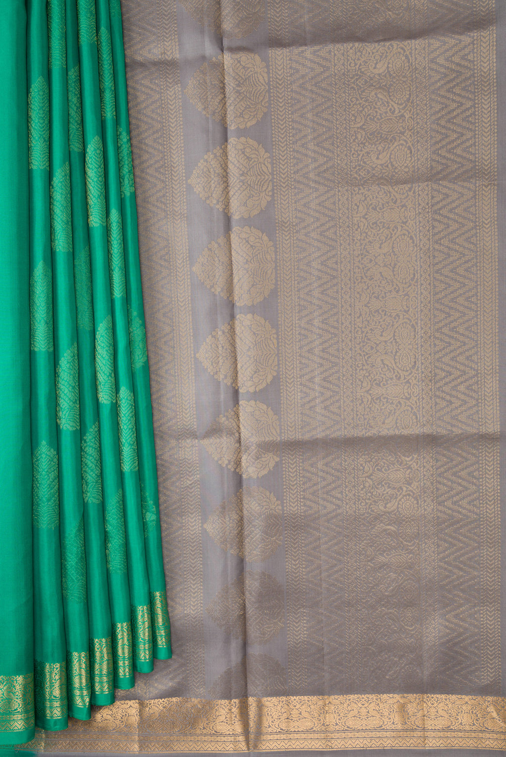 Pleats and pallu of Green Dual Tone Soft Silk Saree with Zari Butta on the body and Zari Border. 
