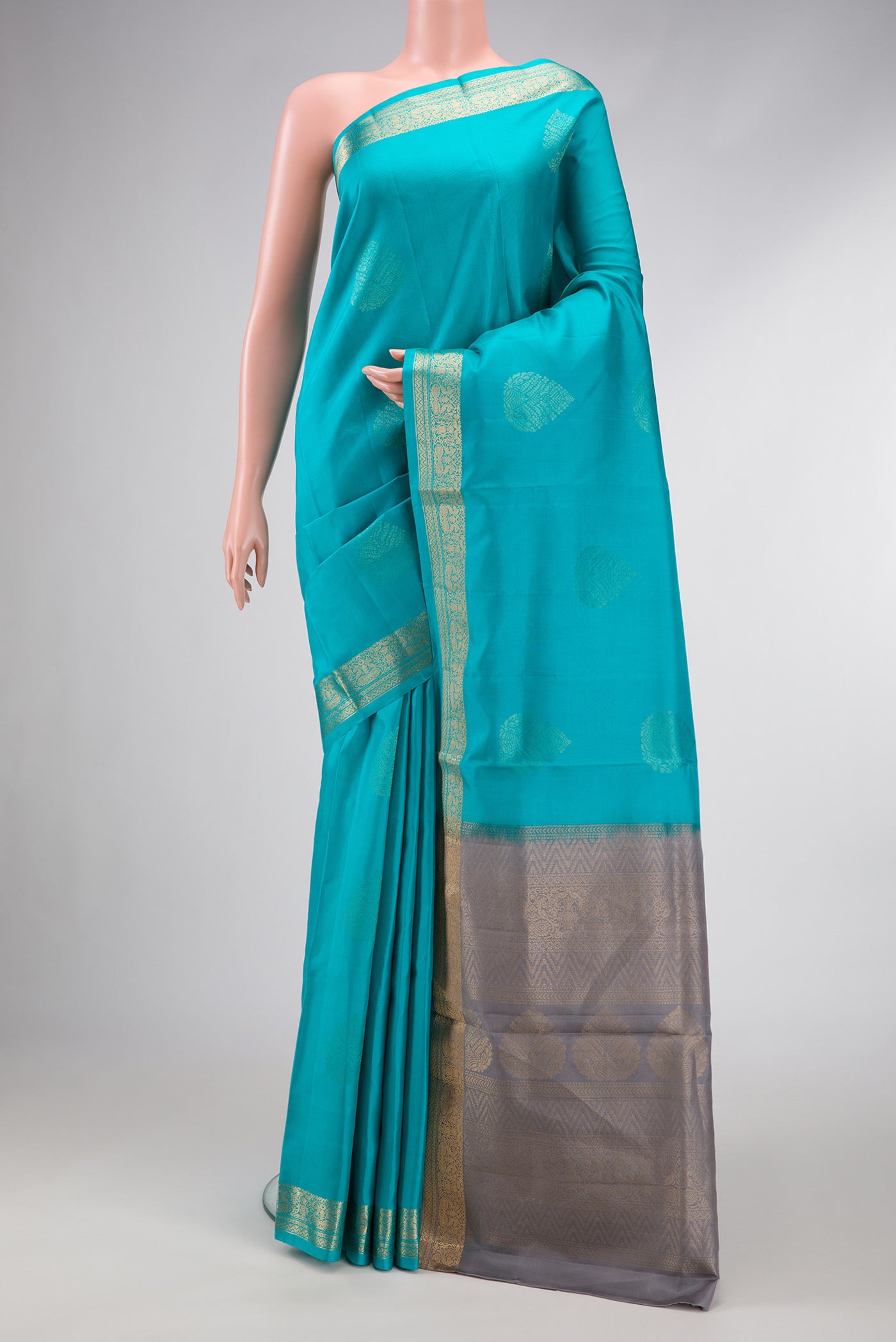 Sky Blue Dual Tone Soft Silk Saree with Zari Butta on the body and Zari Border.  displayed on a mannequin