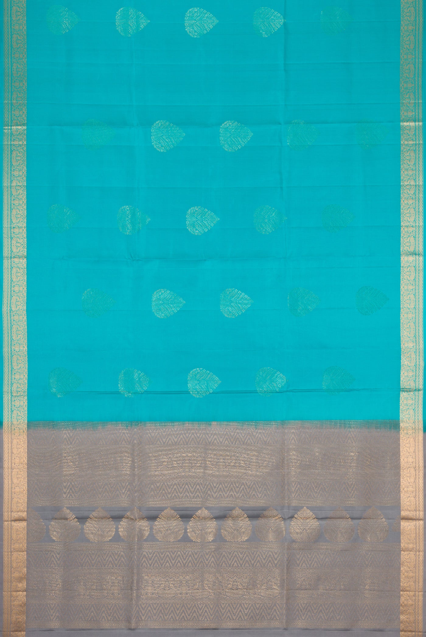 Flat view of Sky Blue Dual Tone Soft Silk Saree with Zari Butta on the body and Zari Border. 