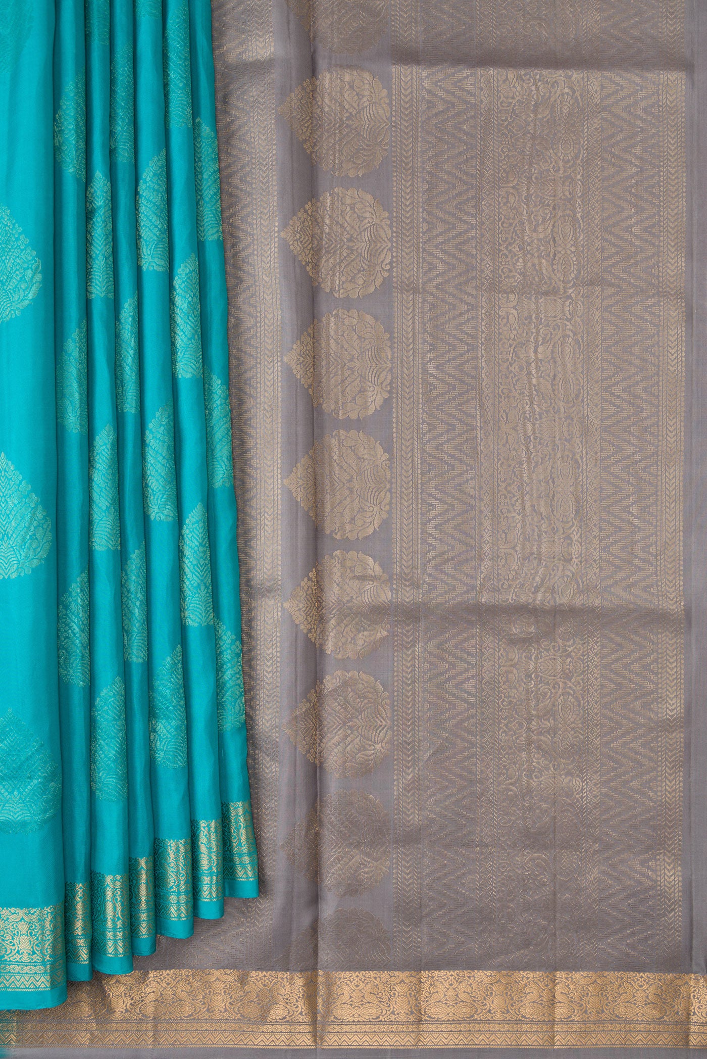 Pleats and pallu of Sky Blue Dual Tone Soft Silk Saree with Zari Butta on the body and Zari Border. 