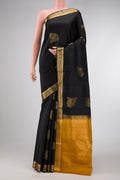 Black Dual Tone Soft Silk Saree with Zari Butta on the body and Zari Border.  displayed on a mannequin