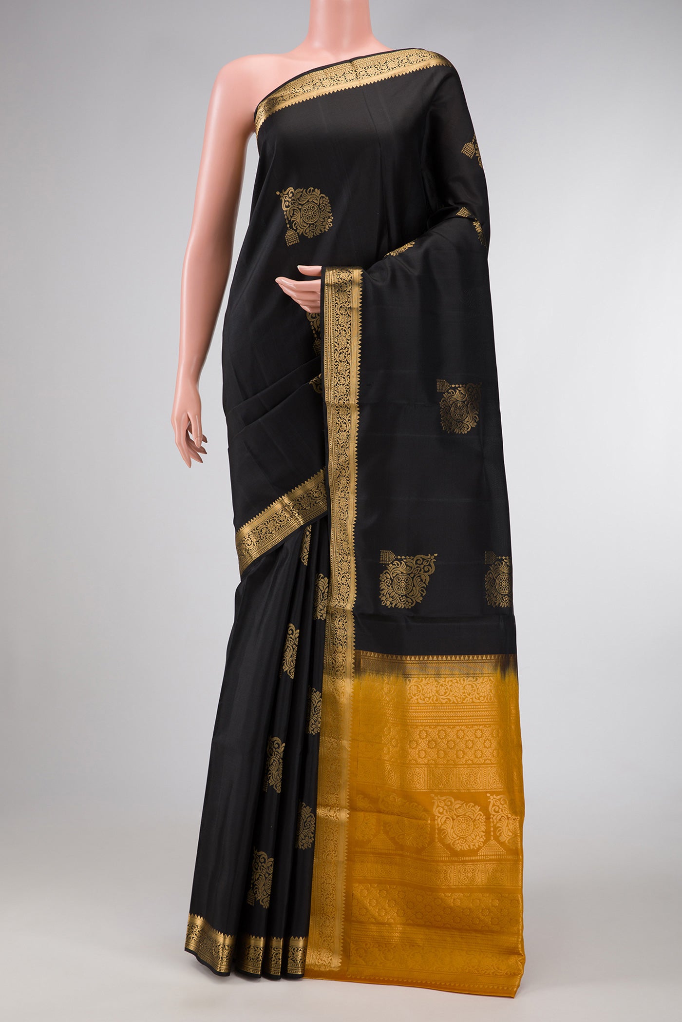 Black Dual Tone Soft Silk Saree with Zari Butta on the body and Zari Border.  displayed on a mannequin