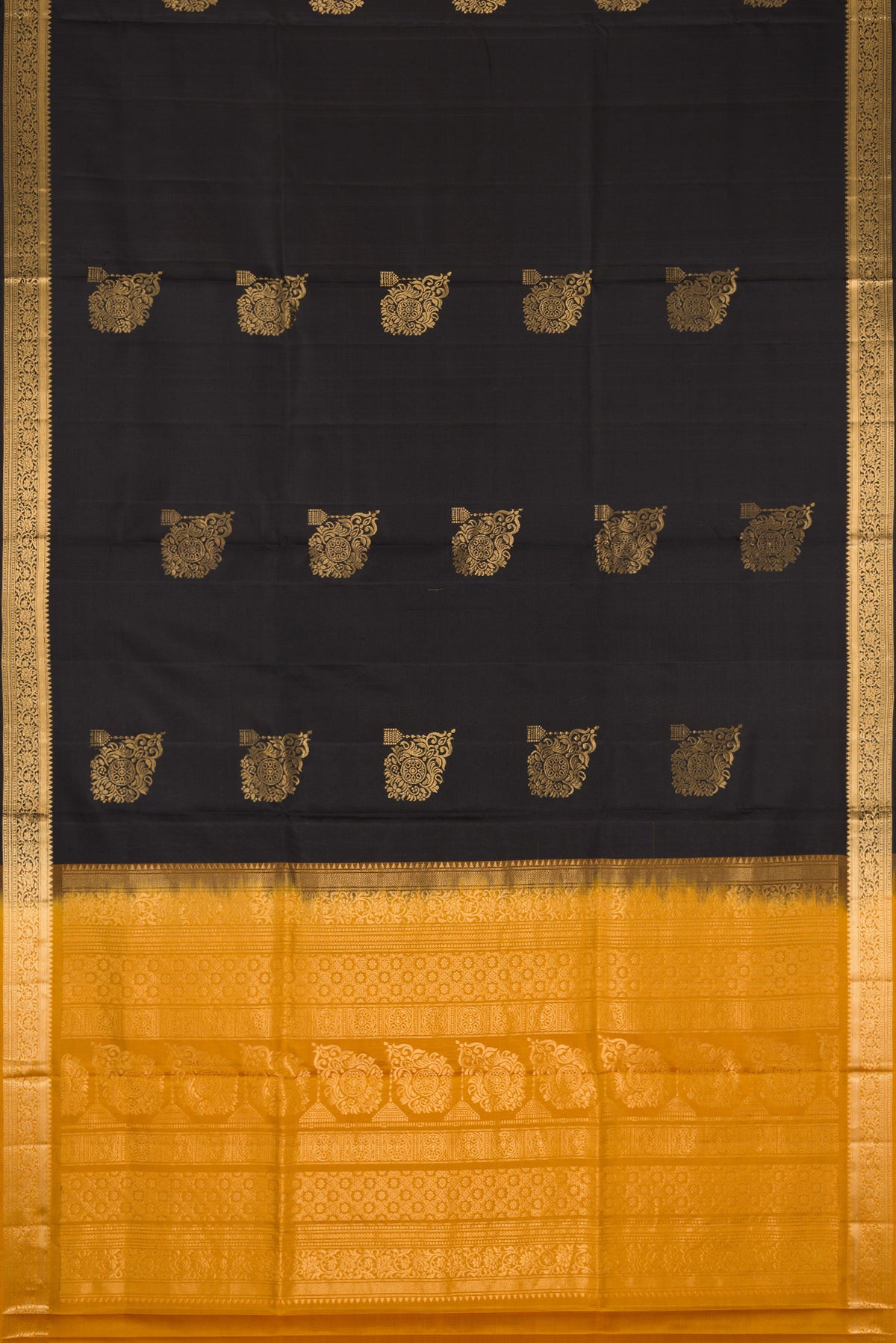 Flat view of Black Dual Tone Soft Silk Saree with Zari Butta on the body and Zari Border. 