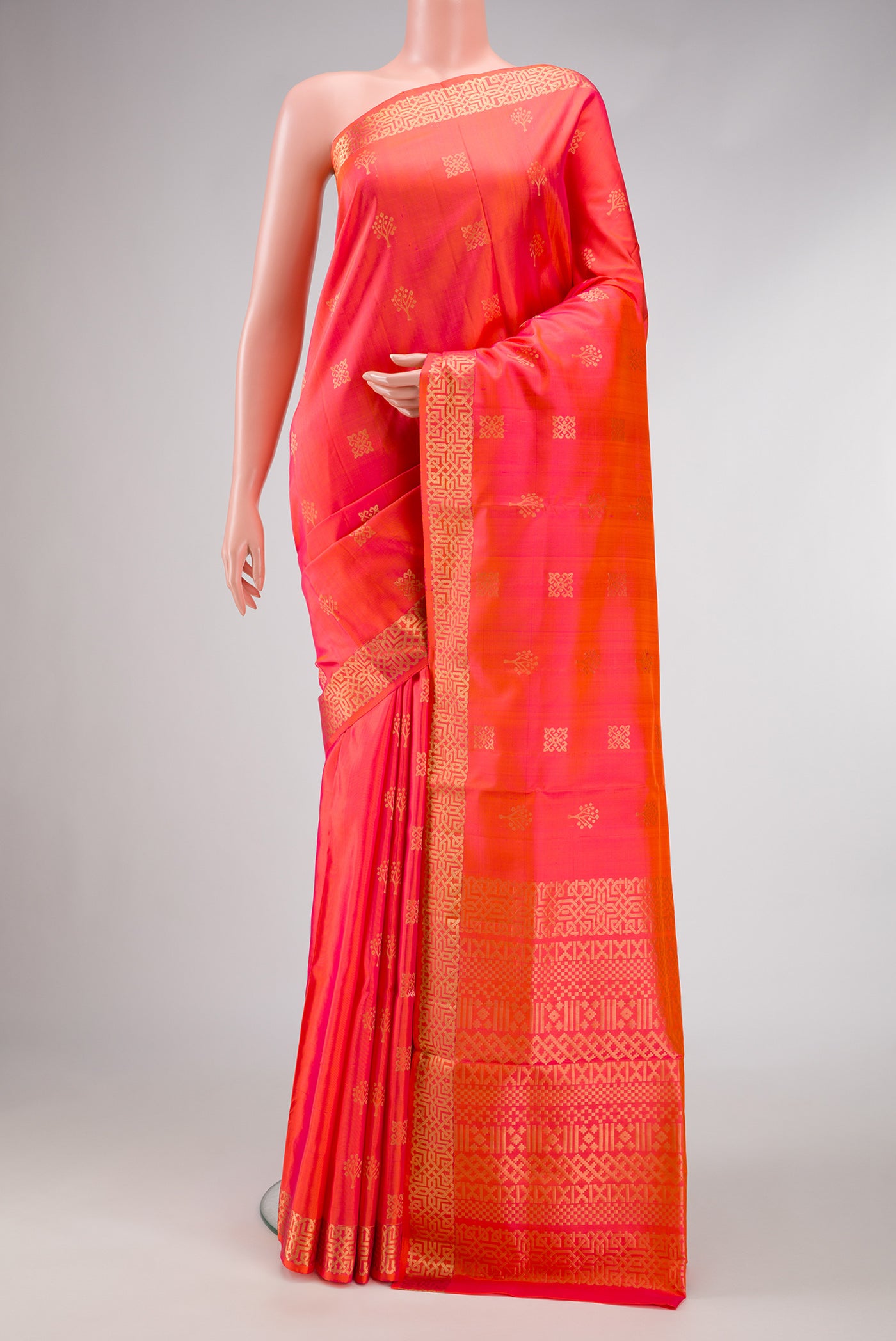 Orange Dual Tone Soft Silk Saree with Zari Butta on the body and Zari Border.  displayed on a mannequin